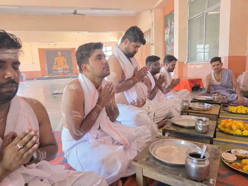 Devotees with folded hands as the mantras are chanted