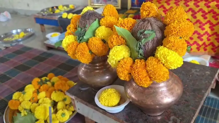 Kalash and marigolds on the altar